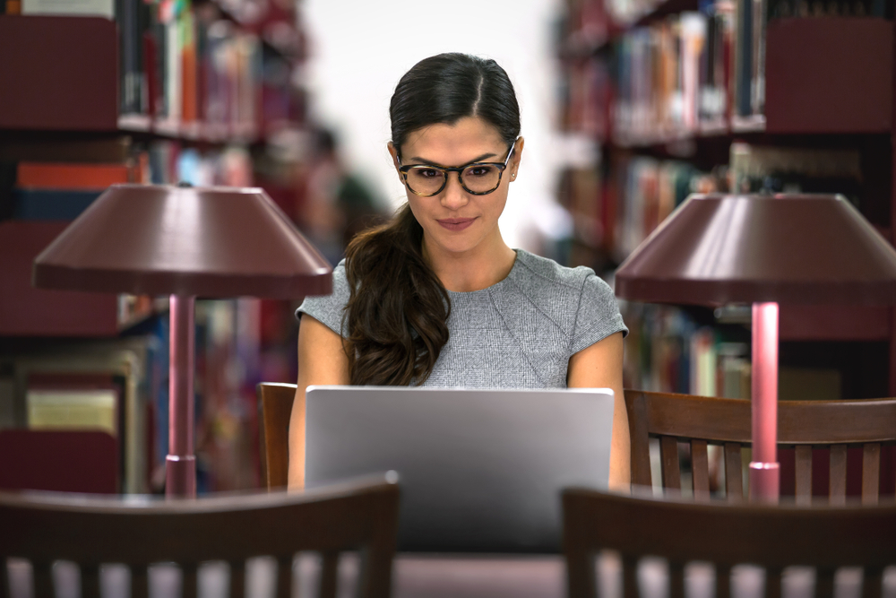 student studying in law library