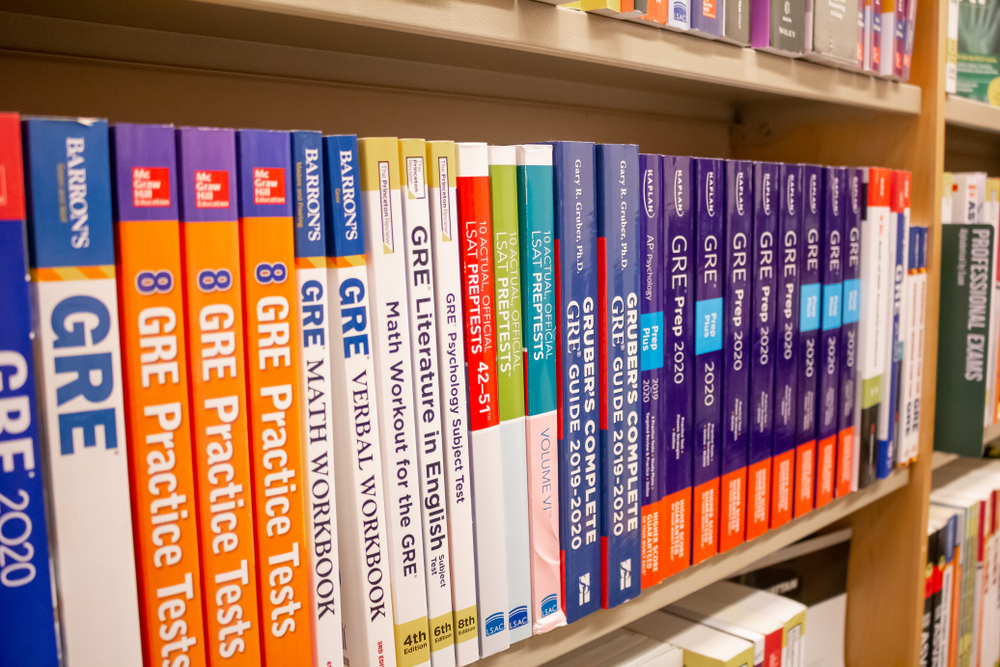 several GRE study guides on a shelf